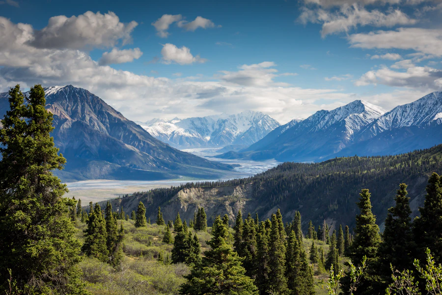 A dramatic alpine mountain summit above green valleys